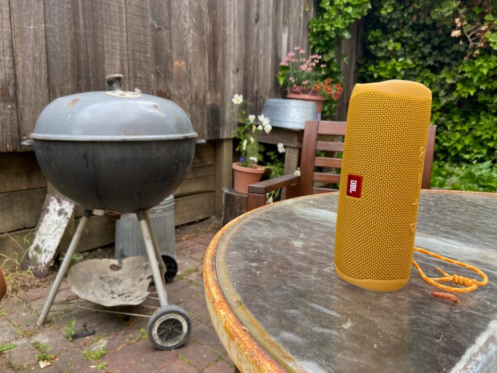 jbl flip 5 Bluetooth speaker near a grill