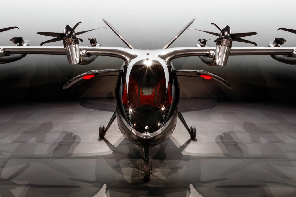 The propellers in the front have five blades and can tilt and change their pitch. The two-bladed affairs in the back are   simpler, and provide lift for takeoff and landing. 