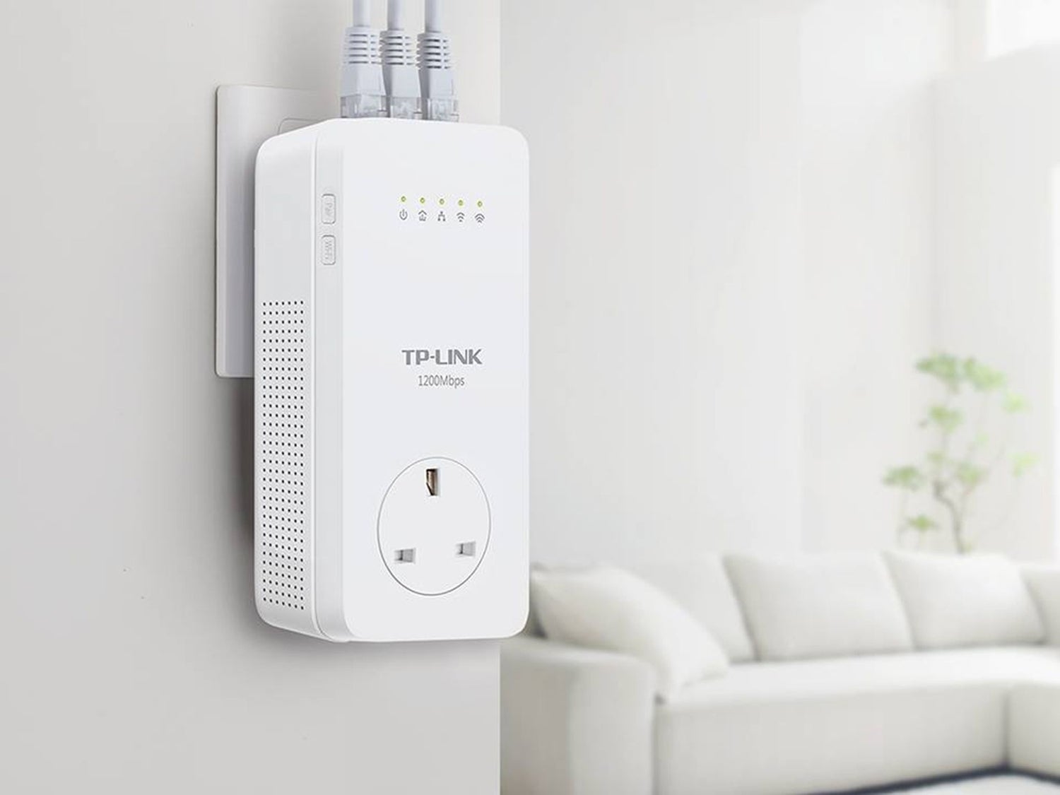 A white powerline adapter plugged into a wall.