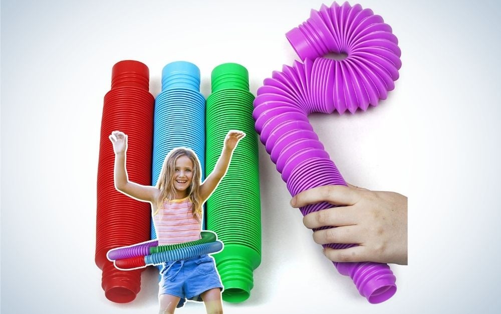 Different colored BunMo Toys with a girl playing with them and someone touching the toy.