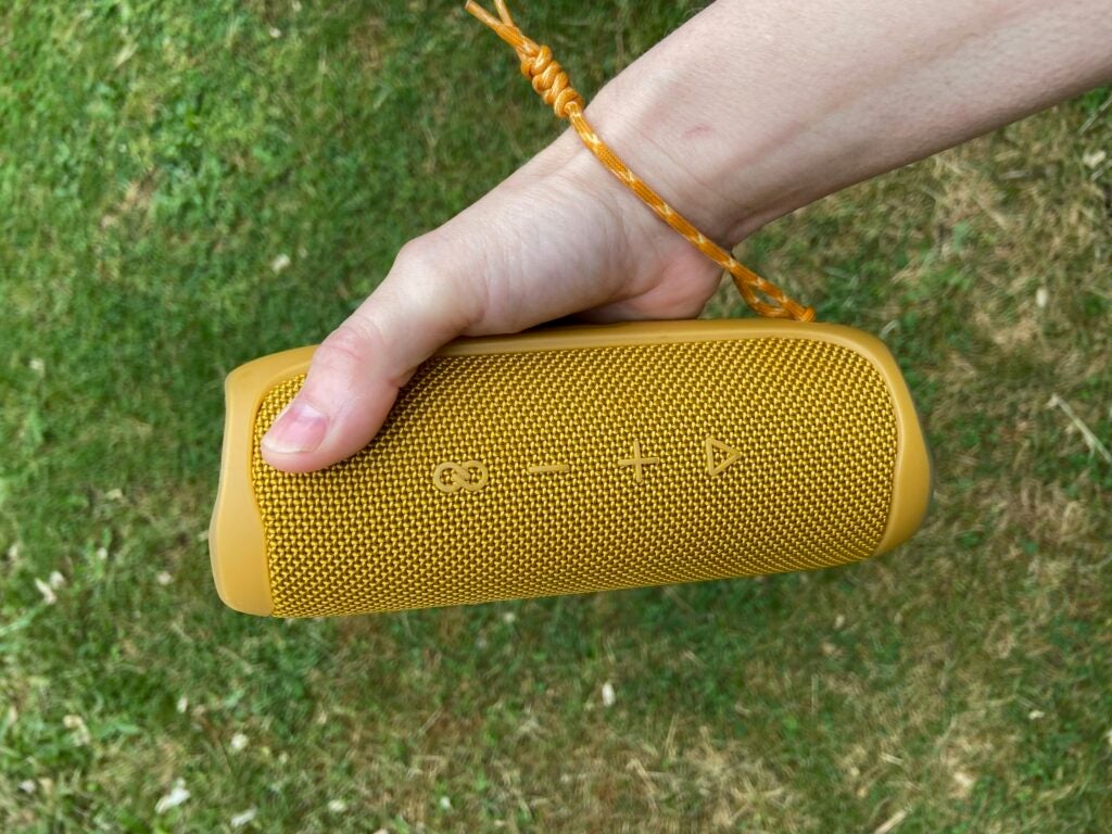 jbl flip speaker in a hand
