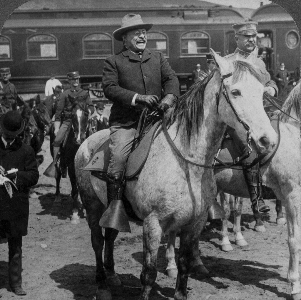 Teddy Roosevelt on a horse in Yellowstone National Park in black and white