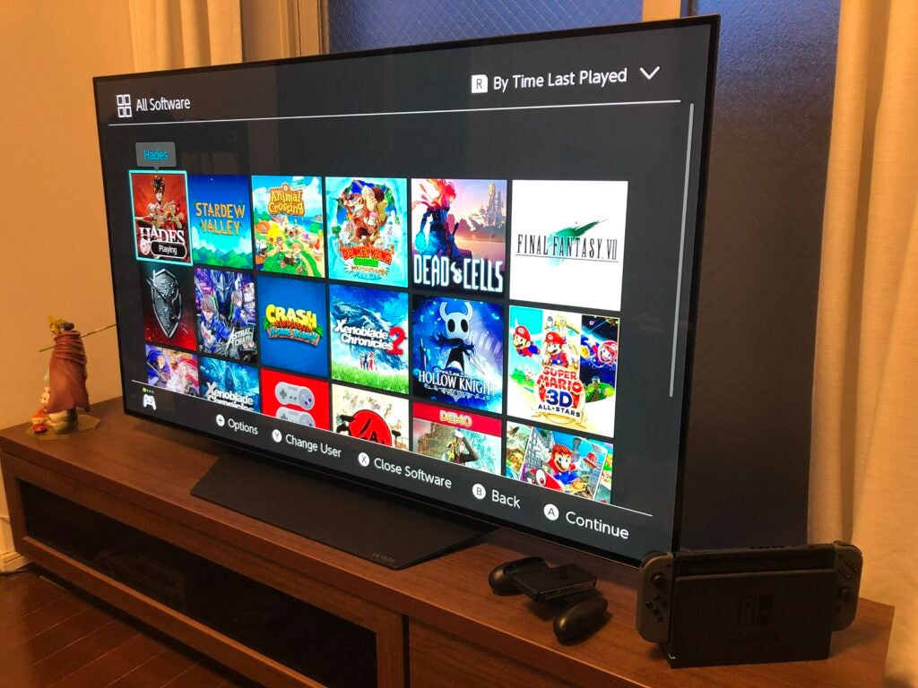 Nintendo Switch docked next to a flatscreen TV
