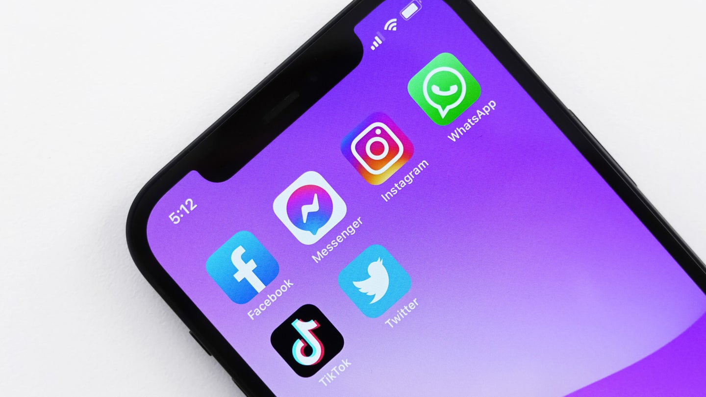 An iPhone with Facebook, Facebook Messenger, Instagram, WhatsApp, TikTok, and Twitter apps visible.