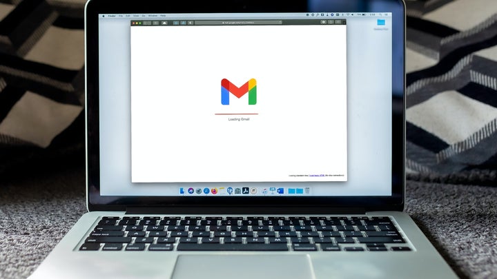 A laptop with Gmail loading in a browser.