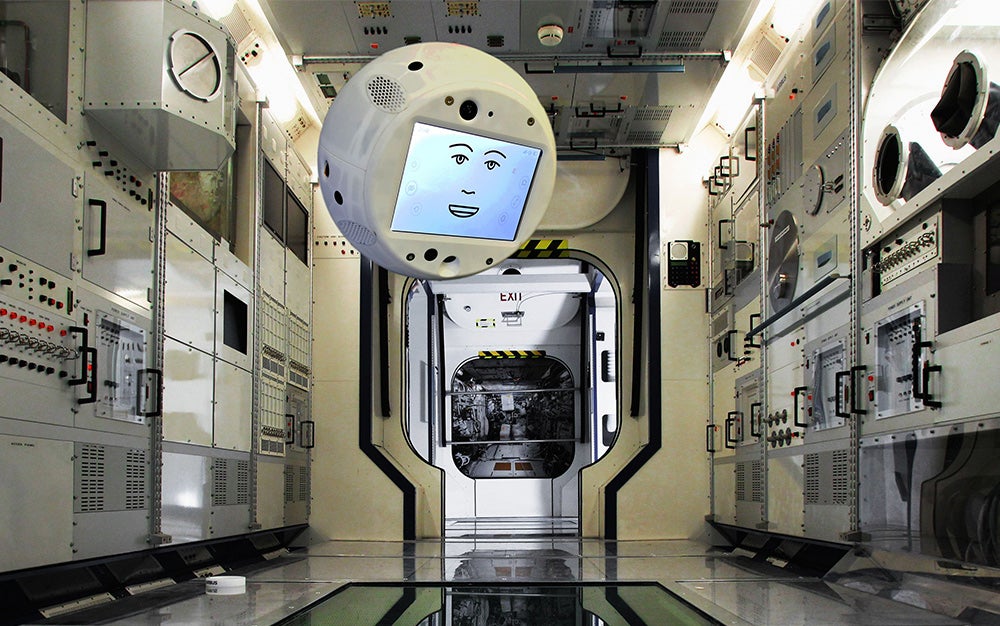 Floating AI Astronaut Assistant CIMON by Airbus & IBM in a spacecraft