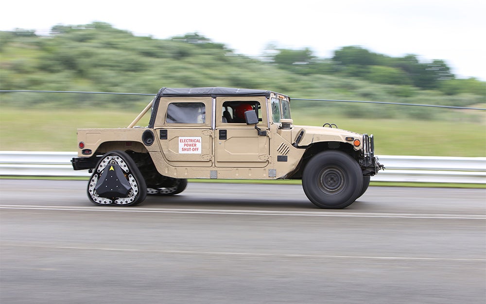 Reconfigurable humvee wheel track by Darpa and Carnegie Mellon on a vehicle on the road