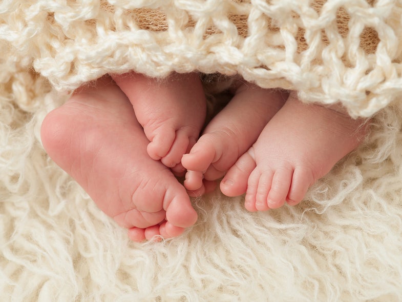 baby feet under blanket