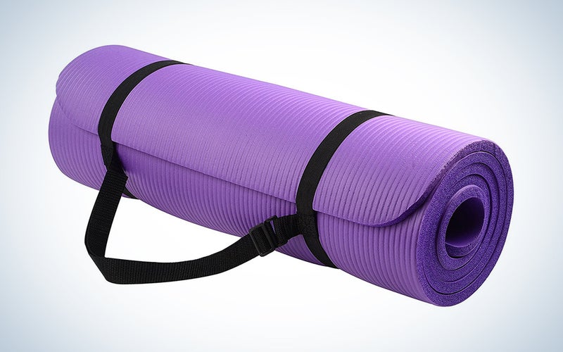 rolled up purple yoga mat