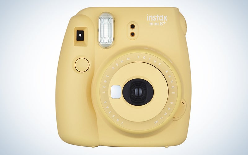 a yellow instax fujifilm camera