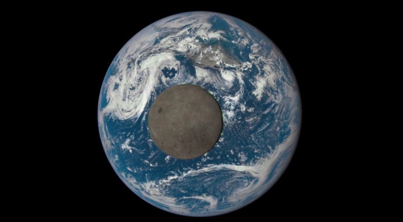 the moon crossing in front of the earth