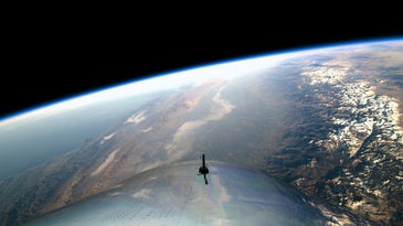 earth is visible from the window of a rocket in space
