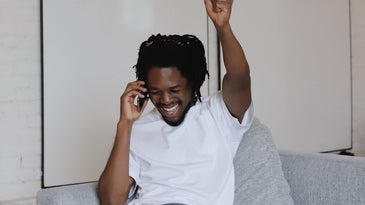 man celebrating on the phone