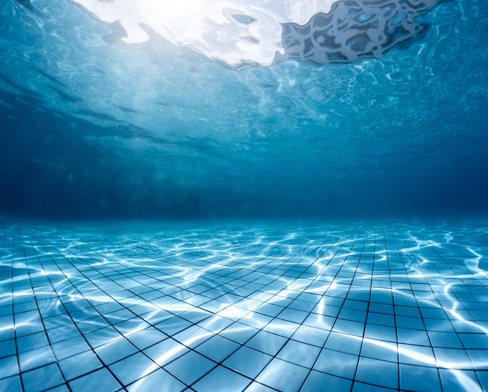 A swimming pool, from under the water.
