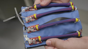 A piece of blue fabric with electronics attached