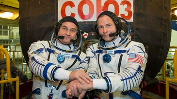 two astronauts posing together 