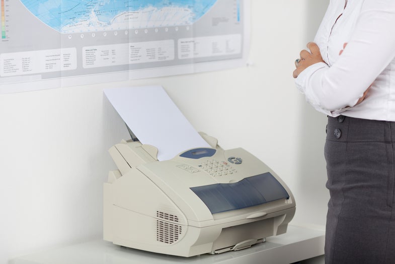 A fax machine in use.