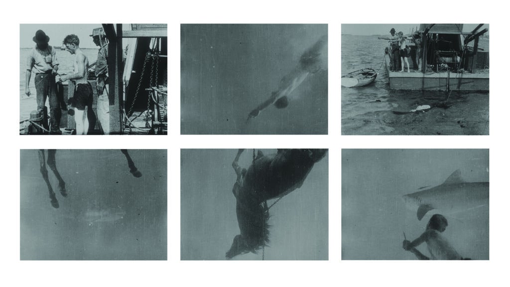 old photos of men filming underwater