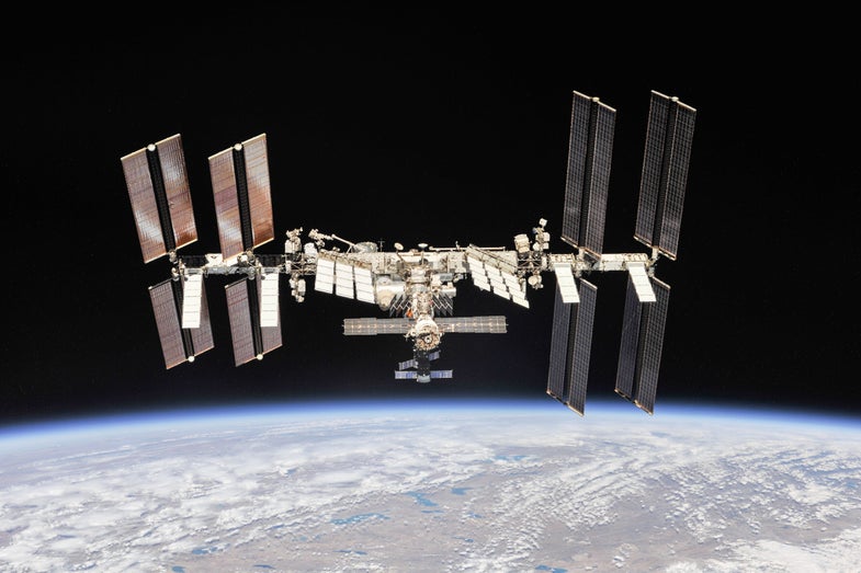 the international space station floats over earth