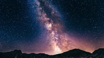 The Milky Way at night over mountains.