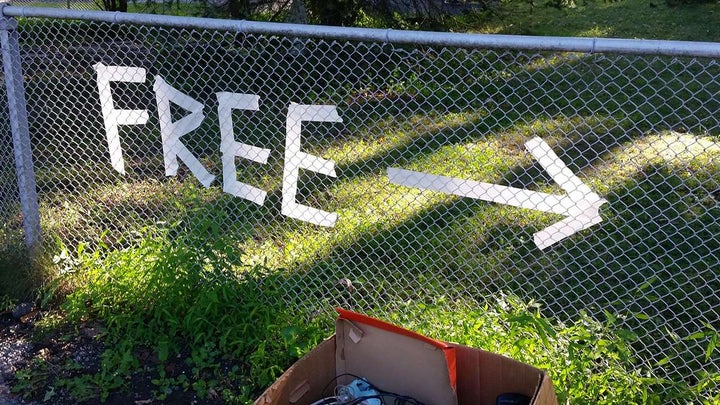 a sign made of tape that points to free stuff