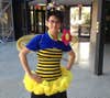 men in bee costume