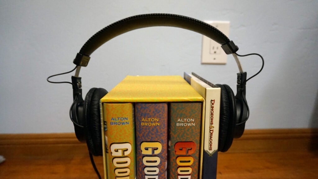 stretching headphones out over books