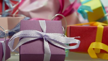 purple gift box with silver ribbon 
