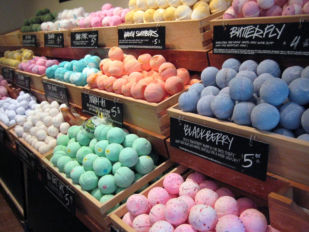 a store display of many colorful bath bombs