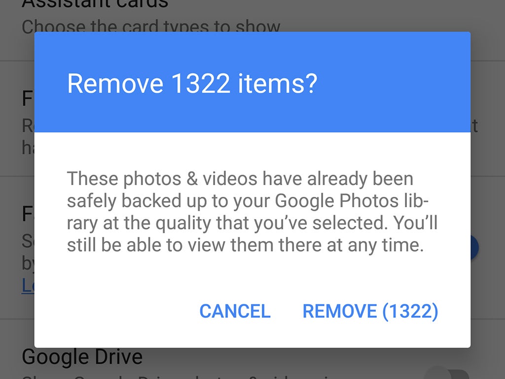 A Google Photos dialog box asking if the user wants to remove 1,322 items.