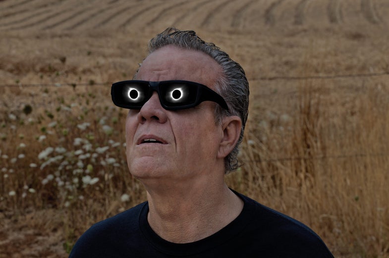 man watching eclipse