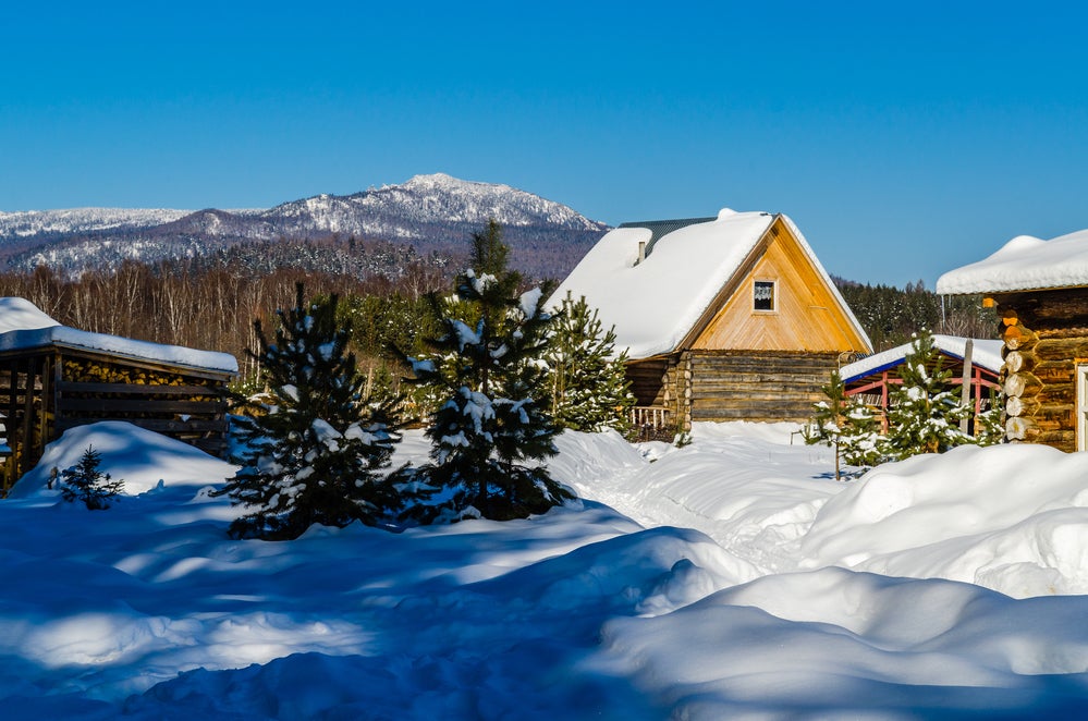 cabin covered in snow