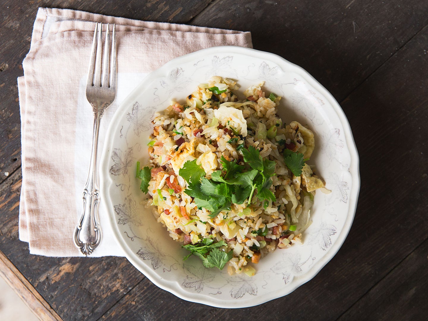 This simple fried rice is as good for breakfast as it is for dinner. Thick-cut bacon will make for more meaty, chewy bits. Cookbook writer Amy Thielen often adds a little sauerkraut for a further Midwestern touch. <a href="https://www.saveur.com/bacon-and-egg-fried-rice-recipe">Get the recipe for bacon and egg fried rice »</a>
