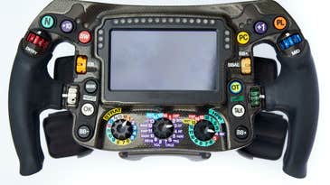 The steering wheel in an F1 race car requires fighter jet components and lots of practice