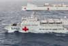 The two hospital ships at RIMPAC 2014, the USNS Mercy and the PLAN's Peace Ark, travel in formation (the larger Mercy is located to the Peace Ark's right). Hospital ships like these play important roles in providing humanitarian and medical assistance during natural disasters like typhoons and earthquakes.