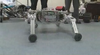 Professor Shigeo Hirose at the Tokyo Institute of Technology has three different rescue 'bots, each designed for a slightly different purpose, demonstrated in <a href="http://news.bbc.co.uk/2/hi/science/nature/8069435.stm">this BBC video</a>. The first is a snake-like robot that's mostly notable for the presence of wheels on all sides--it can continue moving no matter which side is up. The second is a slightly hardier version of the snake-bot--still snake-like, but with treads instead of wheels and a tougher exterior, resistant to dust and water and able to handle more demanding conditions. But the one that's really interesting is the third, which examines organic biology to figure out which mode of locomotion is best. When moving over very uneven terrain, legs tend to work best--you can position them to land on flatter or sturdier steps, compared to, say, treads. But on flat ground, some sort of wheel is preferable--faster, requiring much less energy, and more stable. So Hirose devised an ingenious convertible leg that can turn into a wheel when necessary, and then propel itself with a movement inspired by rollerskating.