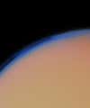 This enhanced Voyager 1 image taken in 1980 shows Saturn's largest moon Titan enveloped in a thick layer of haze. At Voyager's closest approach to Titan, spacecraft instruments found that the moon has an atmosphere far denser than that of Mars and possibly denser than Earth's.