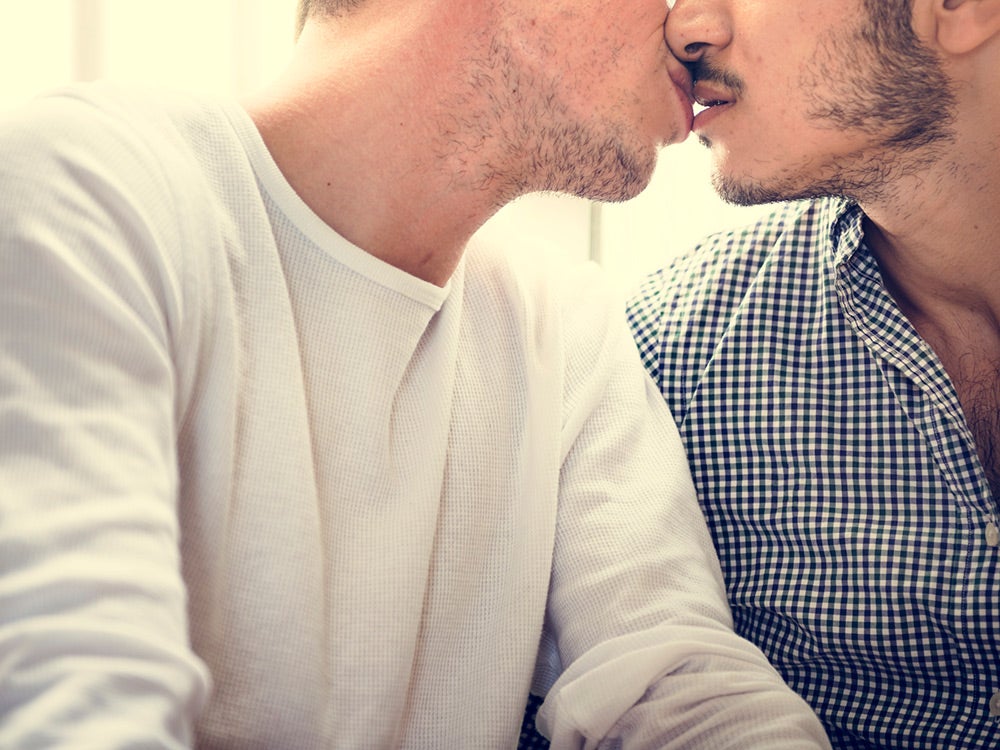 young men kissing