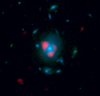 This image combines data from ALMA and the Hubble Space Telescope. Shown in red is a distant, background galaxy, being distorted by the gravitational lens effect produced by the galaxy in the foreground. That galaxy is shown in blue and was measured by Hubble. The background galaxy appears warped into a so-called Einstein ring: a circle of light around the foreground galaxy. Astronomers first spotted signs of the distant galaxies with the South Pole Telescope, and then used ALMA to zoom in on them in greater detail. They were surprised to find that many of these galaxies were farther away than expected.