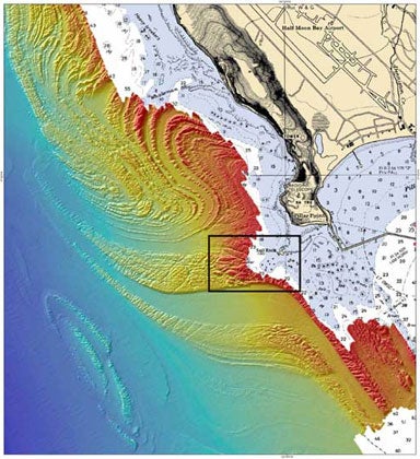 Contours offshore from Pillar Point north of Half Moon Bay. The color gradient ranges from deeper water (blue) to shallow water depths (red). The Mavericks wave break is indicated by a black box offshore from Sail Rock.