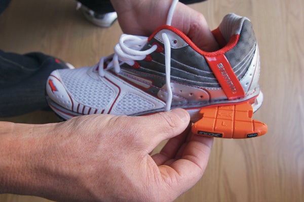 Inserting a custom cushion into the shoe's heel