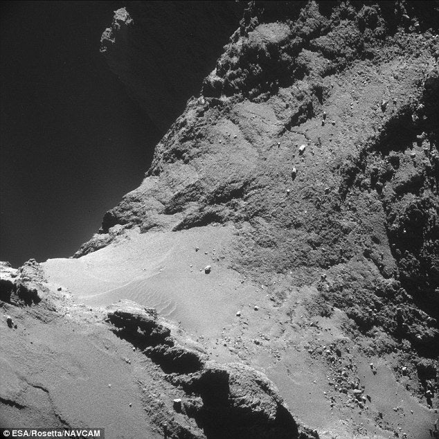 Examine the surface detail of a comet as never seen before. The Rosetta spacecraft, <a href="https://www.popsci.com/article/technology/esa-confirms-rosettas-landing-site-rubber-ducky-comet/">scheduled to make contact </a>with comet 67P/Churyumov-Gerasimenko on November 12, took this remarkable photo of the "rubber ducky" comet. The image shows the extraterrestrial landscape in high contrast, with sand dunes drifting across the middle. It looks beautiful, but the comet apparently smells awful, like "<a href="http://www.npr.org/blogs/thetwo-way/2014/10/24/358364942/european-scientists-conclude-that-distant-comet-smells-terrible/">sharing a horse barn with a drunk and a dozen rotten eggs</a>."