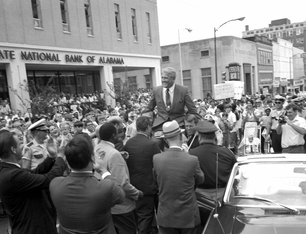 Meanwhile in Huntsville, Alabama, Wernher von Braun, the architect behind the Saturn V, is hoisted on the shoulders of a proud crowd in his hometown the same day Apollo 11 splashed down.