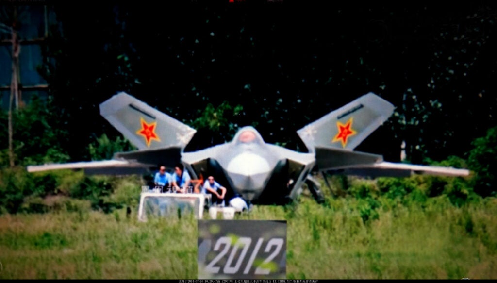 The fourth J-20 stealth fighter is shown here being towed by CAC personnel onto the factory runway. One can easily see the white radome in front of the cockpit, and the electrical optical sensor and targeting pod under the radome. The insert includes the serial number, "2012".