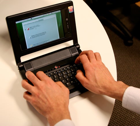 Using the Cloudbook's awkward trackpad requires both hands for clicking and pointing, and windows are often too large for the screen, obscuring the "OK" button.