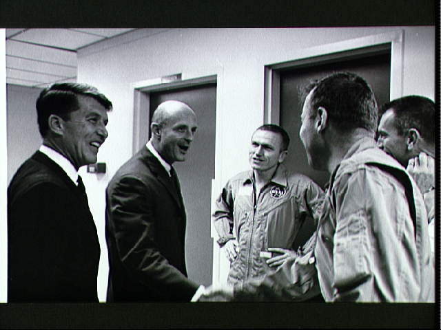 Schirra and Stafford greet Borman and Lovell, post-flight