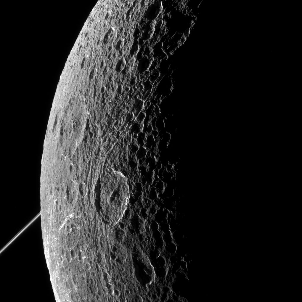 side of the moon's surface with visible moon holes