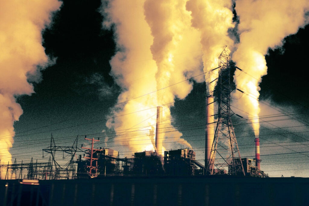 Smoke stacks from a coal power plant emit smoke