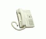 A white corded phone and answering machine.