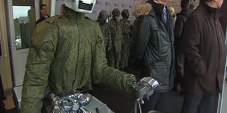 Russian Robot Warrior Drives In A Circle In Front Of Putin